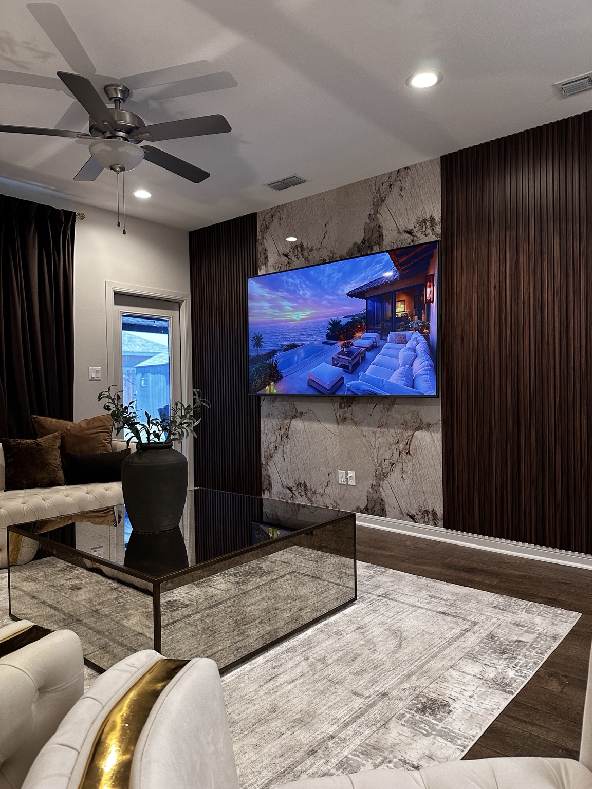 Real Casanovux installation with wood wall panels and a marble-look finish